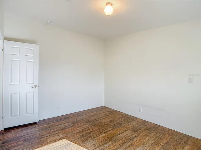 a bathroom with a granite countertop sink a mirror and a shower