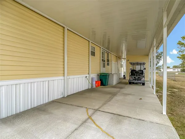 a view of a balcony with wooden floor