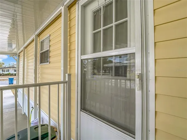 a kitchen with a refrigerator and a sink
