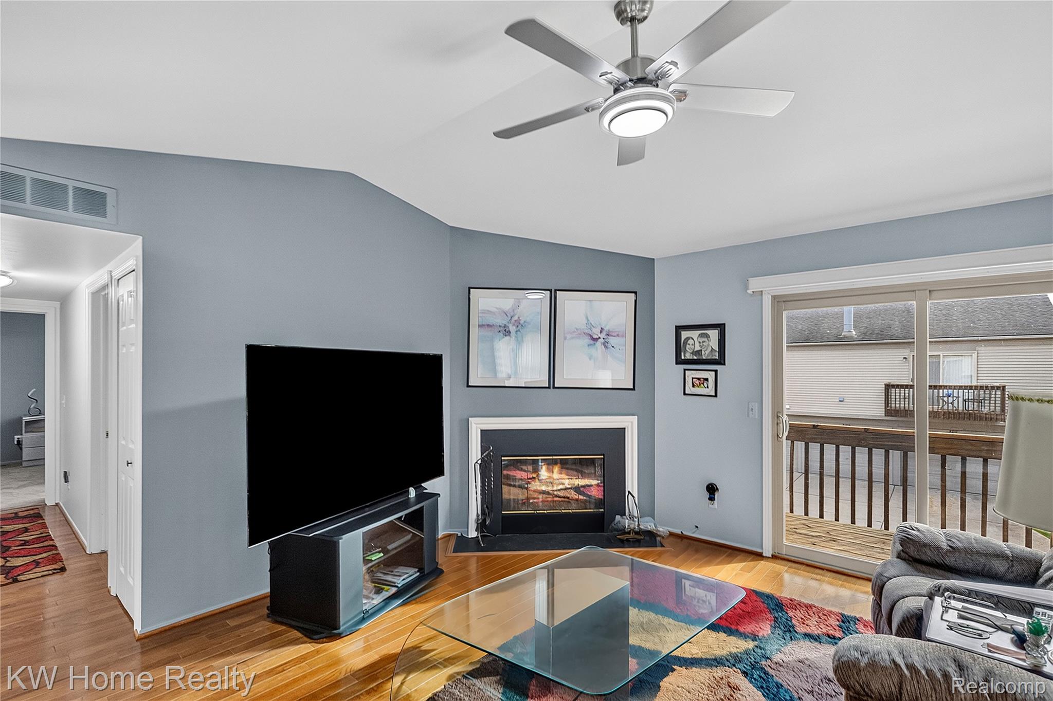 3216 High Pointe Ridge Road Lake Orion, MI 48359 - Photo 6 of 24 Solid Wood flooring in the Living Room, Dining Area and hallway. Enjoy the vaulted ceiling and built-in gas fireplace