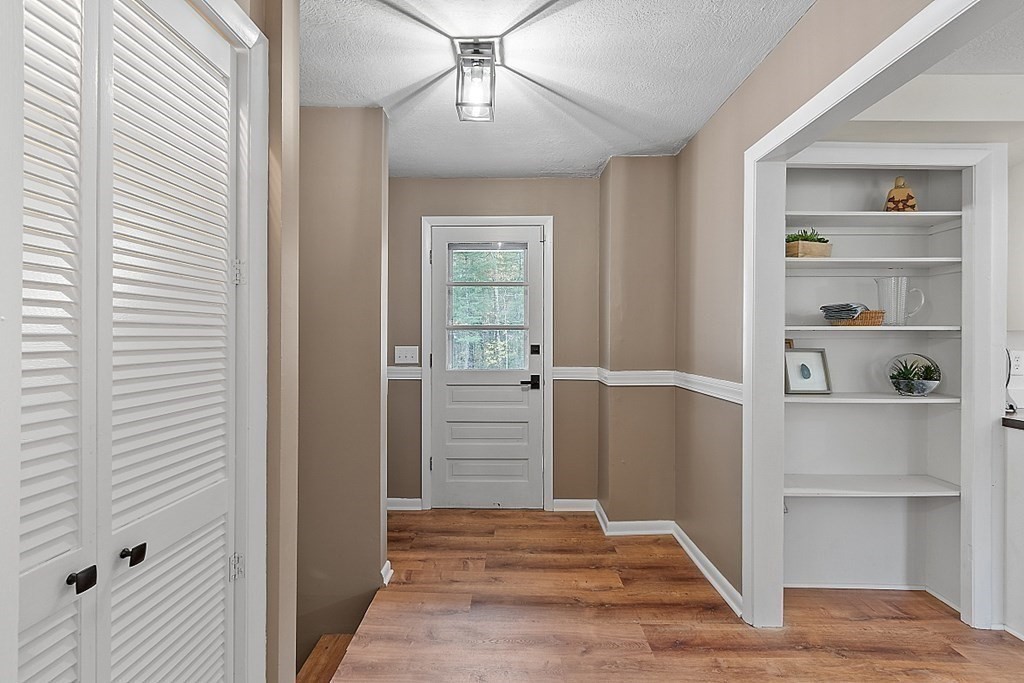 663 Sterling Road Lancaster, MA 01523 - Photo 11 of 33 a view of a hallway with closet and window