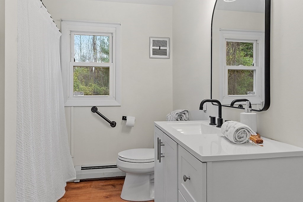 663 Sterling Road Lancaster, MA 01523 - Photo 12 of 33 a bathroom with a sink and a toilet