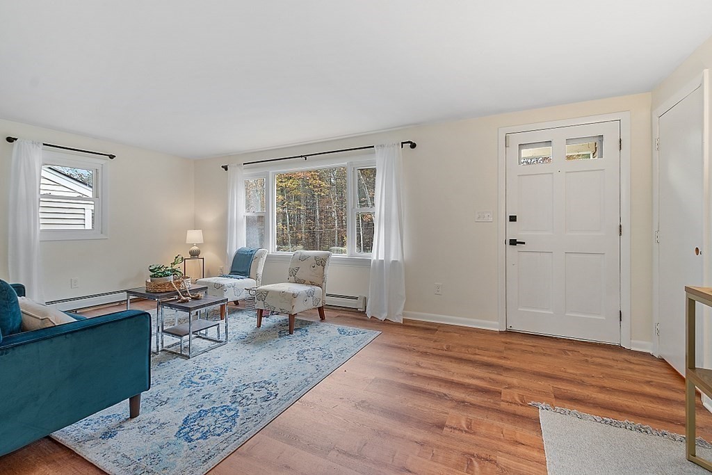 663 Sterling Road Lancaster, MA 01523 - Photo 13 of 33 a living room with furniture and wooden floor