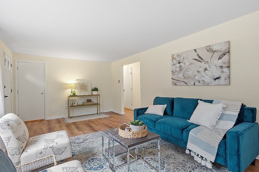663 Sterling Road Lancaster, MA 01523 - Photo 14 of 33 a living room with furniture and wooden floor