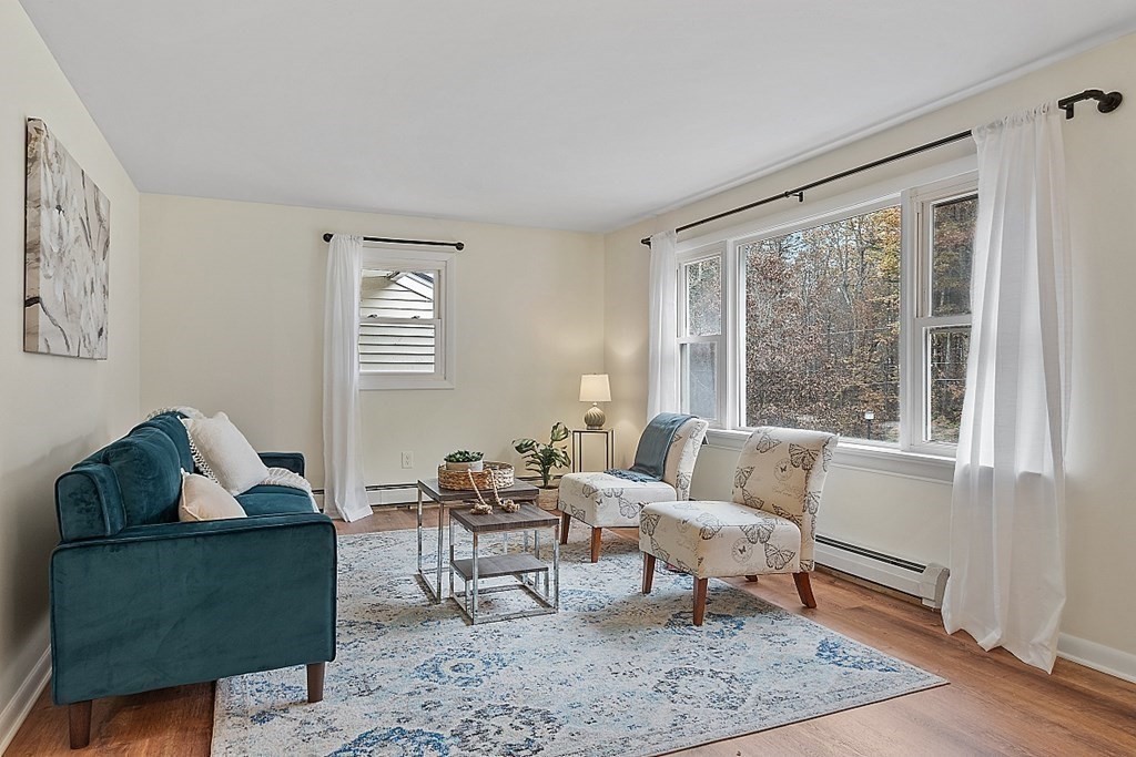 663 Sterling Road Lancaster, MA 01523 - Photo 2 of 33 a living room with furniture and a window