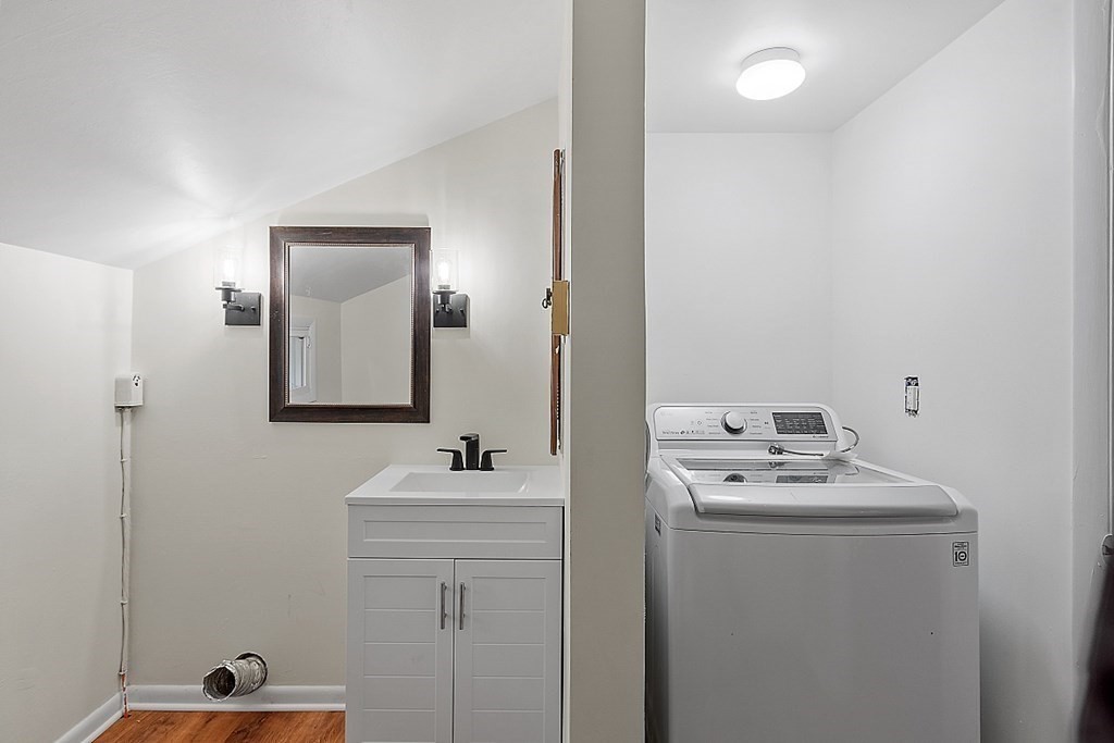 663 Sterling Road Lancaster, MA 01523 - Photo 23 of 33 a bathroom with a sink vanity and mirror