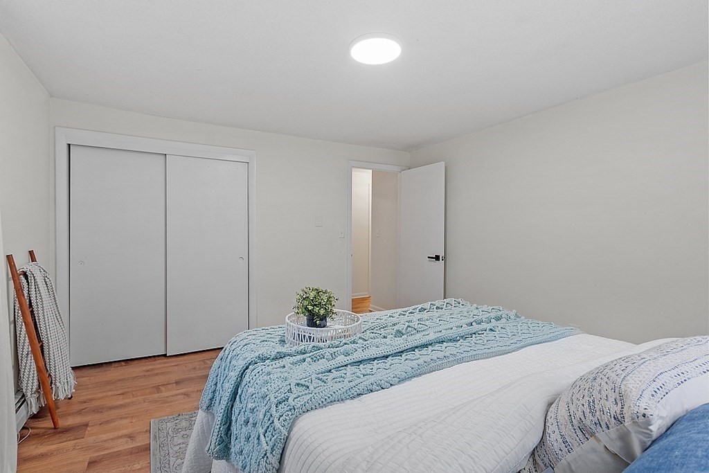 663 Sterling Road Lancaster, MA 01523 - Photo 26 of 33 a bedroom with a bed and a flat screen tv