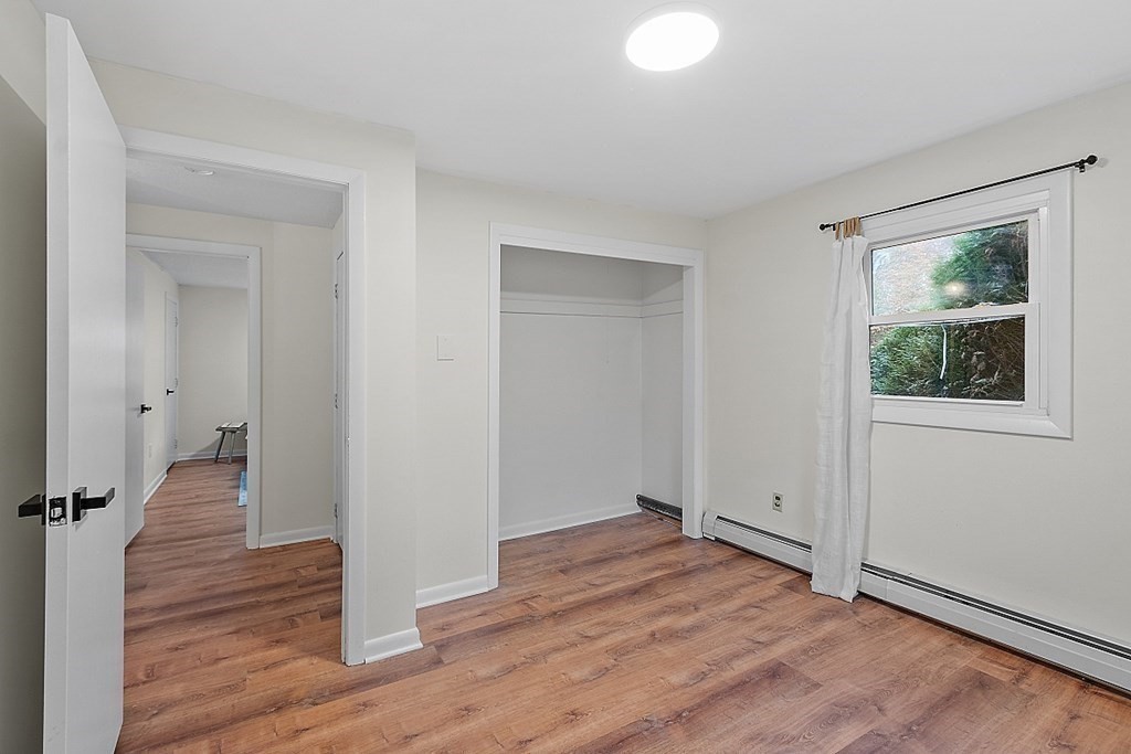 663 Sterling Road Lancaster, MA 01523 - Photo 28 of 33 wooden floor in an empty room