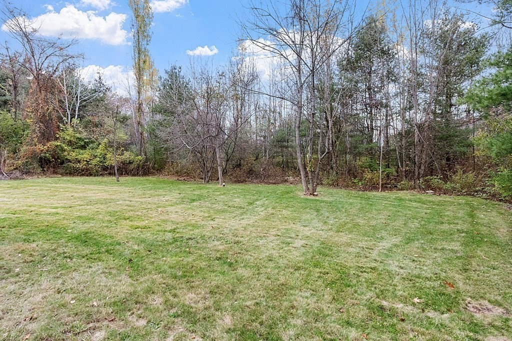 663 Sterling Road Lancaster, MA 01523 - Photo 31 of 33 a view of outdoor space with deck and yard