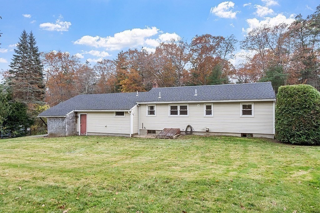 663 Sterling Road Lancaster, MA 01523 - Photo 5 of 33 a view of a house with a big yard and large tree