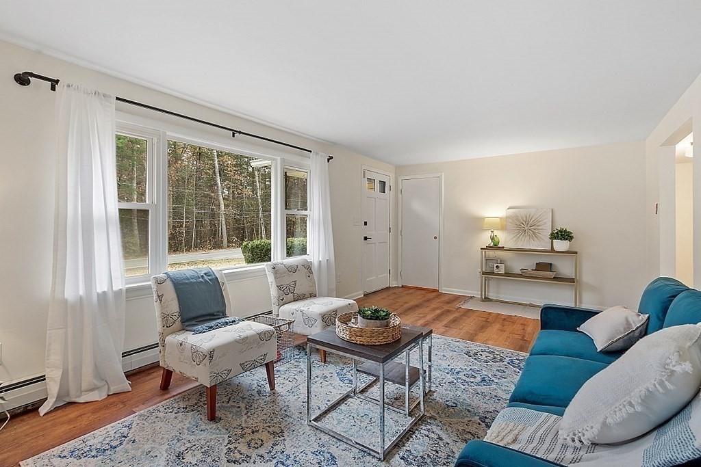 663 Sterling Road Lancaster, MA 01523 - Photo 7 of 33 a living room with furniture and a large window