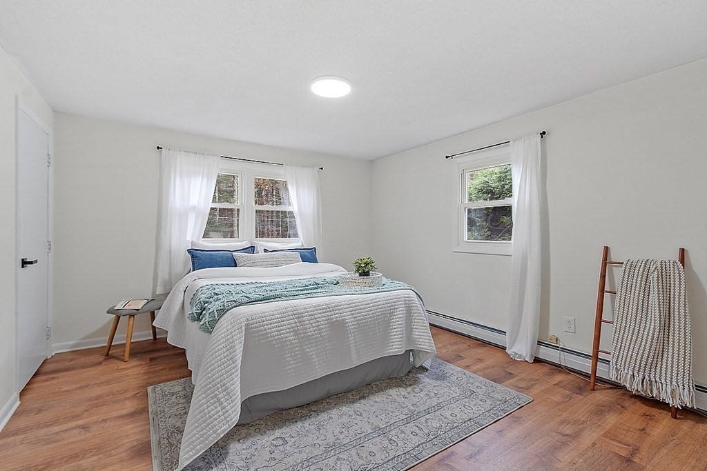 663 Sterling Road Lancaster, MA 01523 - Photo 10 of 33 a bedroom with a bed and a window