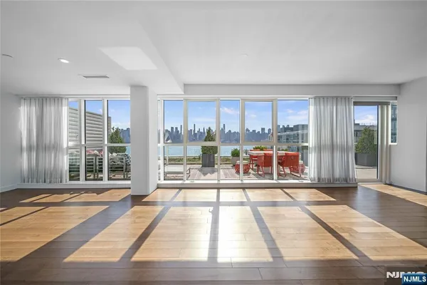 a view of a living room with a large window
