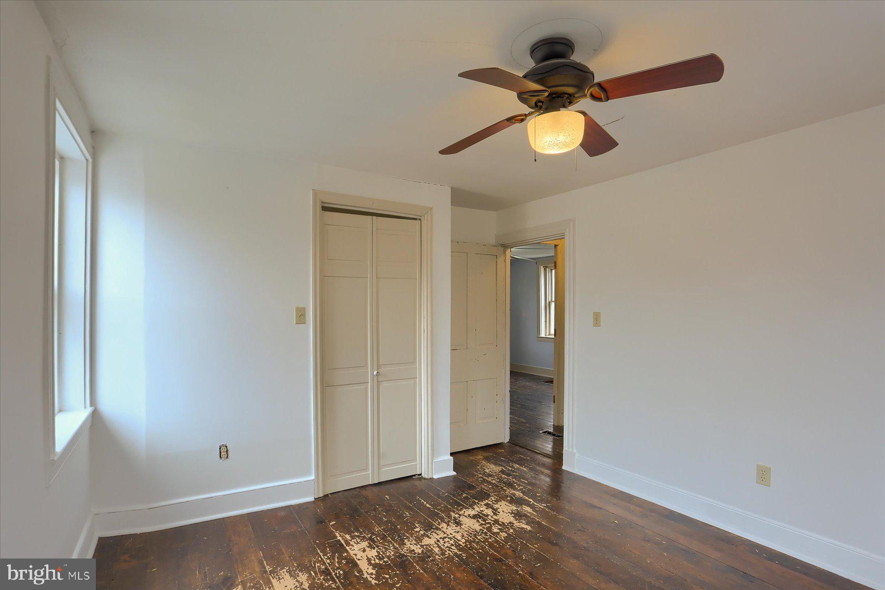 826 Pinetown Road Lewisberry, PA 17339 - Photo 11 of 31 a view of empty room with window and wooden floor