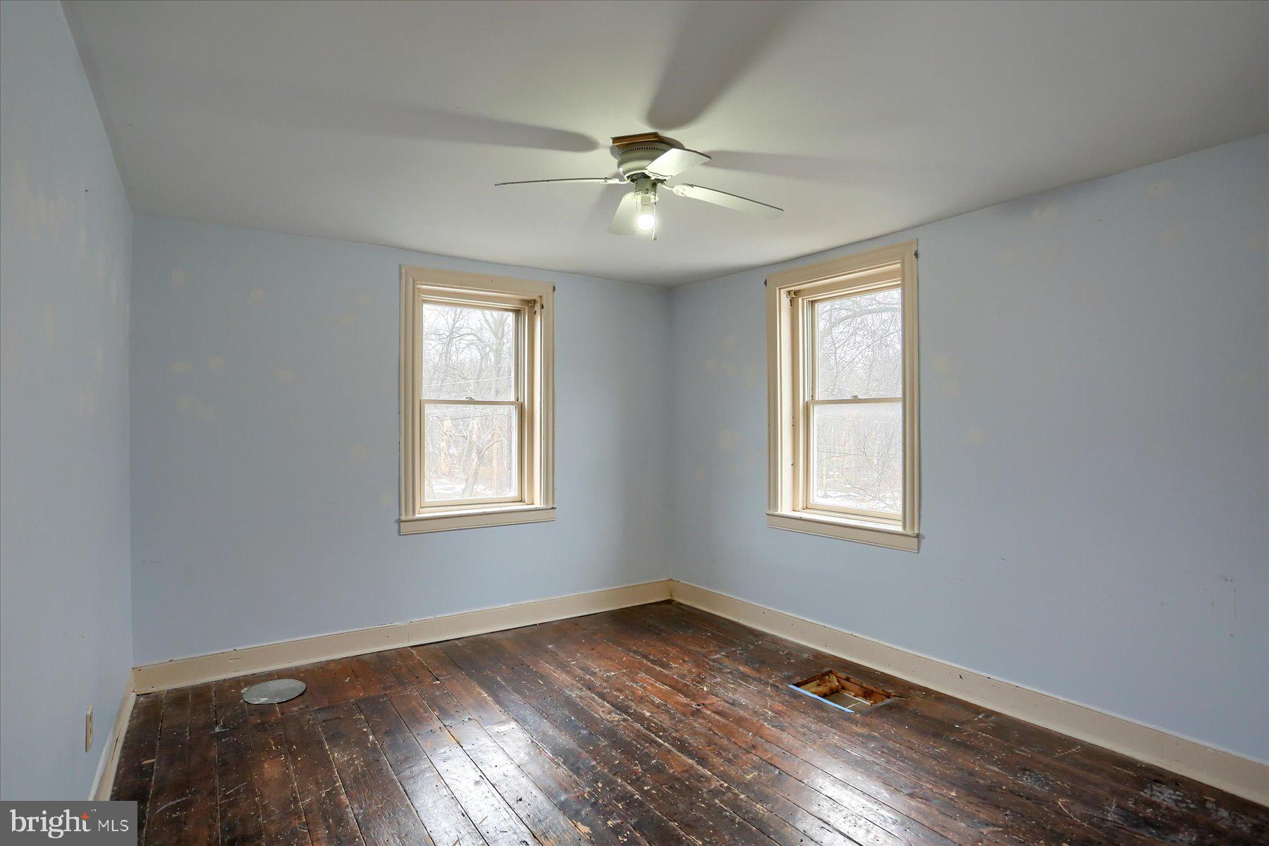 826 Pinetown Road Lewisberry, PA 17339 - Photo 12 of 31 a view of an empty room with wooden floor and a window