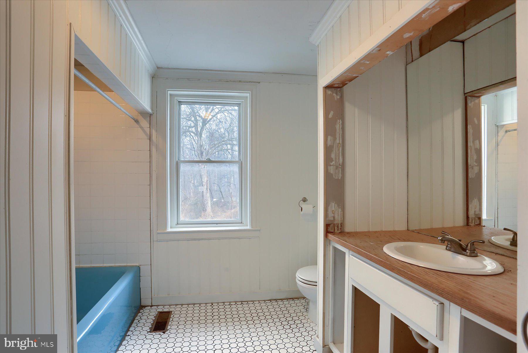 826 Pinetown Road Lewisberry, PA 17339 - Photo 15 of 31 a bathroom with a sink a toilet and a mirror