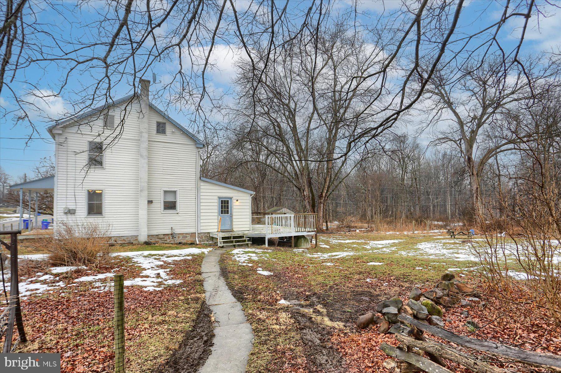 826 Pinetown Road Lewisberry, PA 17339 - Photo 19 of 31 a view of a white house with a yard covered in snow