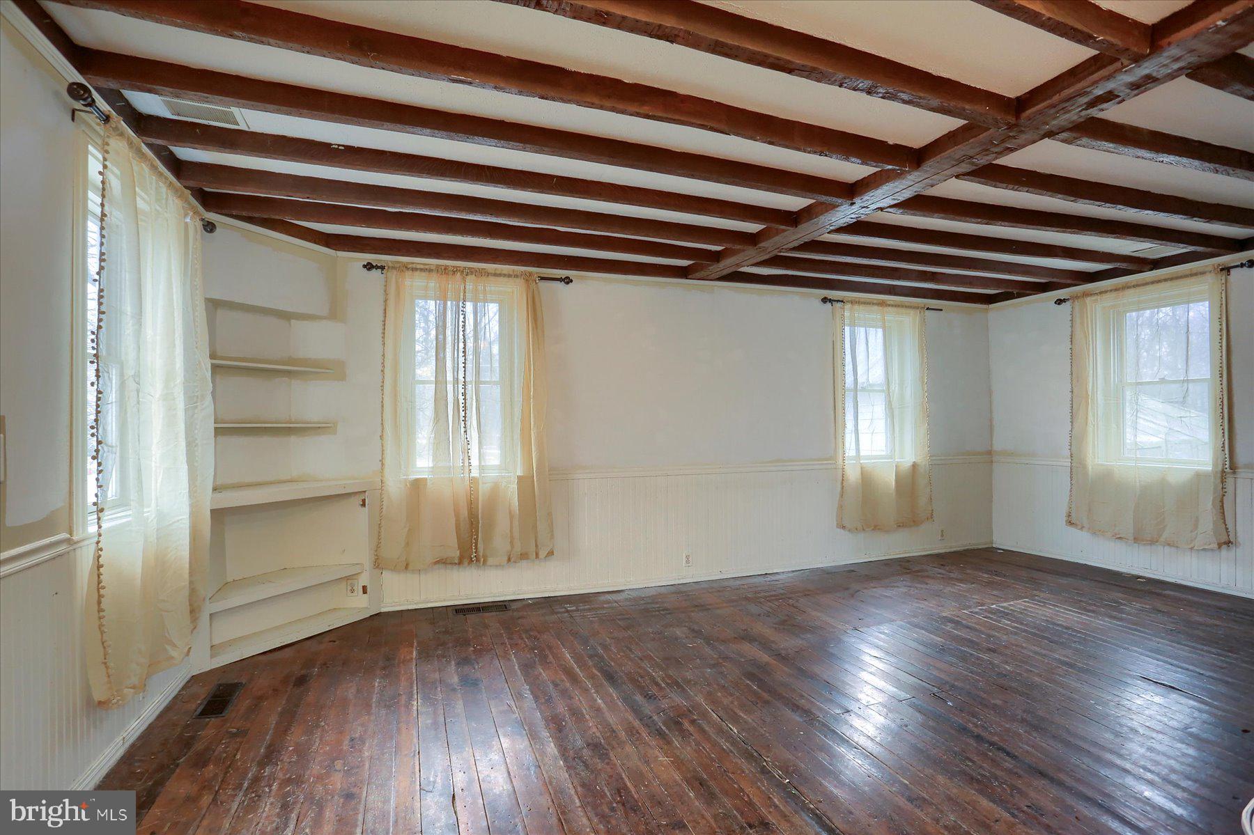 826 Pinetown Road Lewisberry, PA 17339 - Photo 3 of 31 a view of empty room with wooden floor and fan