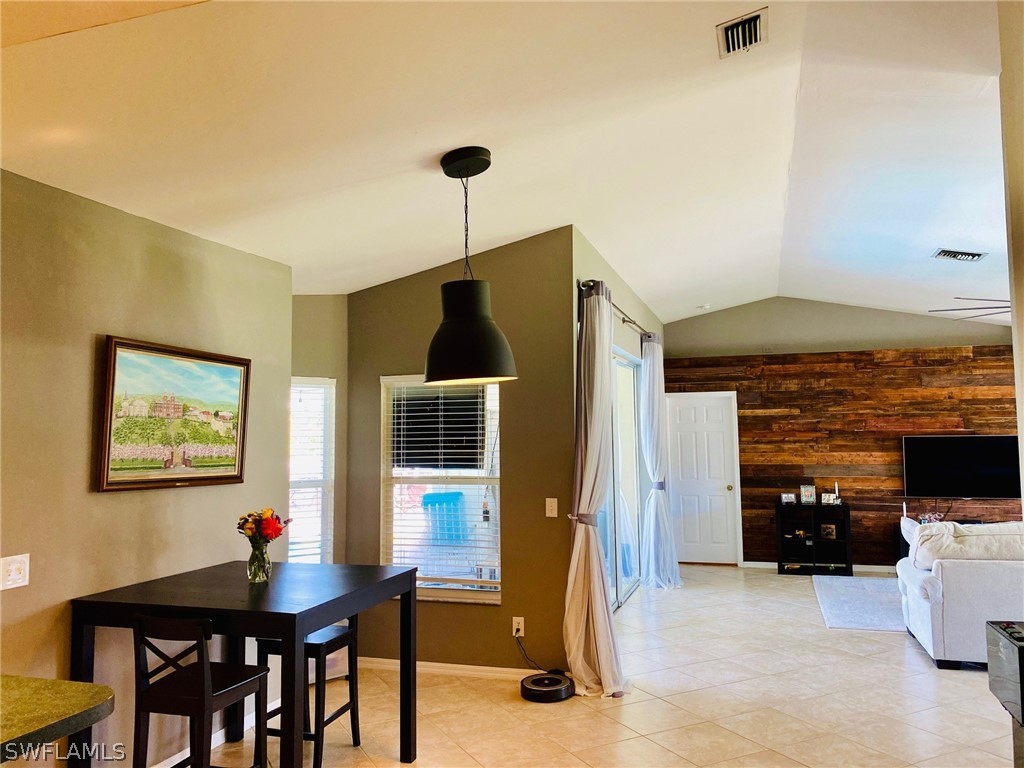 18566 Violet Road Fort Myers, FL 33967 - Photo 10 of 30 a living room with furniture and a flat screen tv