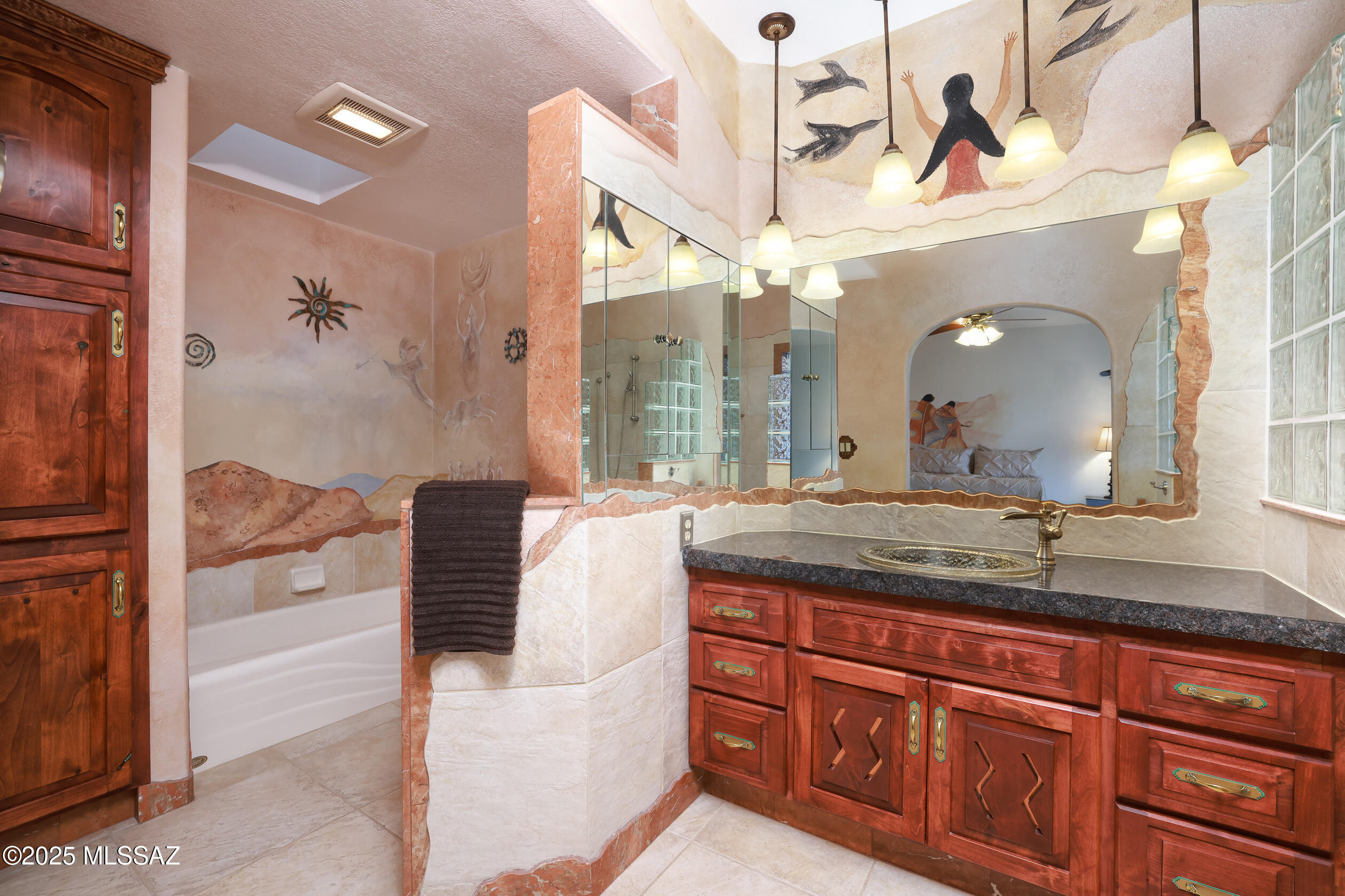925 North Rancho Del Jefe Loop Tucson, AZ 85748 - Photo 23 of 52 a bathroom with a granite countertop sink a mirror and shower