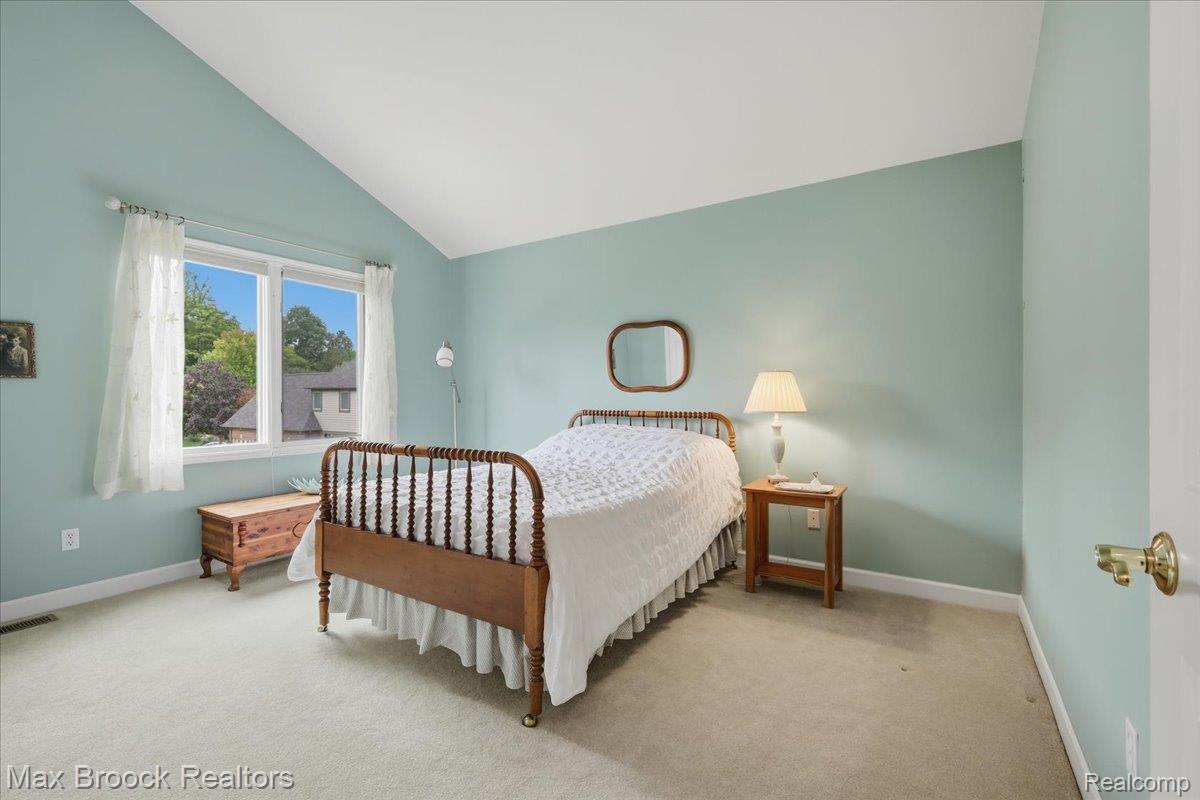 1731 Rico Road Commerce Township, MI 48382 - Photo 33 of 48 Vaulted ceiling with a large window, light-colored carpeting, and light blue wall finish