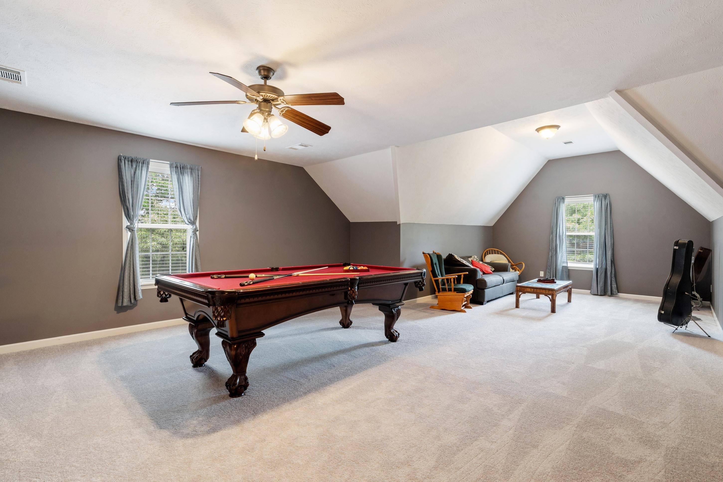 7757 Brunswick Road Millington, TN 38053 - Photo 17 of 40 Spacious bonus room featuring light-colored carpeting, multiple windows, and a ceiling fan with integrated lighting