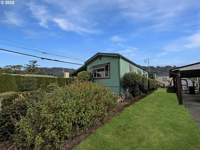 a backyard of a house with lots of green space
