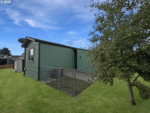 a view of kitchen with wooden floor and electronic appliances