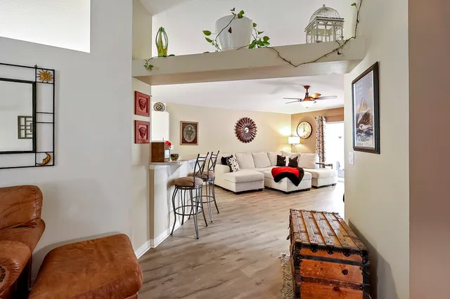 a living room with furniture and a window