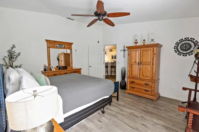 a bed room with a bed and dresser