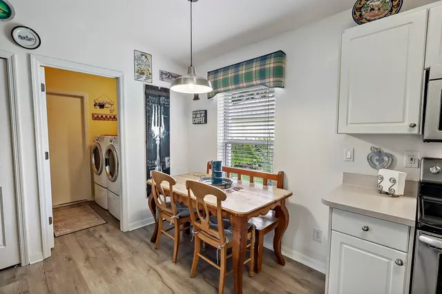 a view of a dining room with furniture window and wooden floor