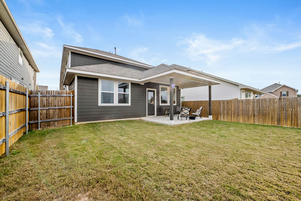 2417 Roosevelt Road Leander, TX 78641 - Photo 37 of 40 a view of a house with backyard and porch