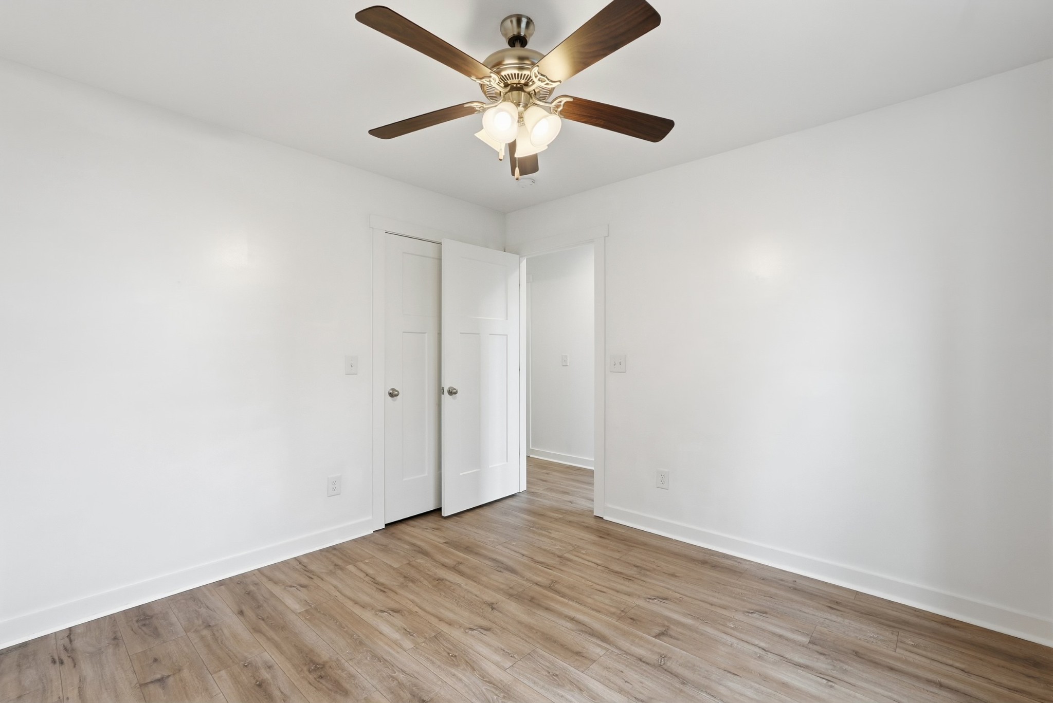 113 11th Avenue West Springfield, TN 37172 - Photo 27 of 27 an empty room with wooden floor and ceiling fan