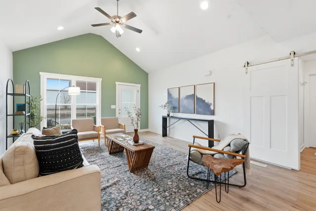 a living room with furniture and a window