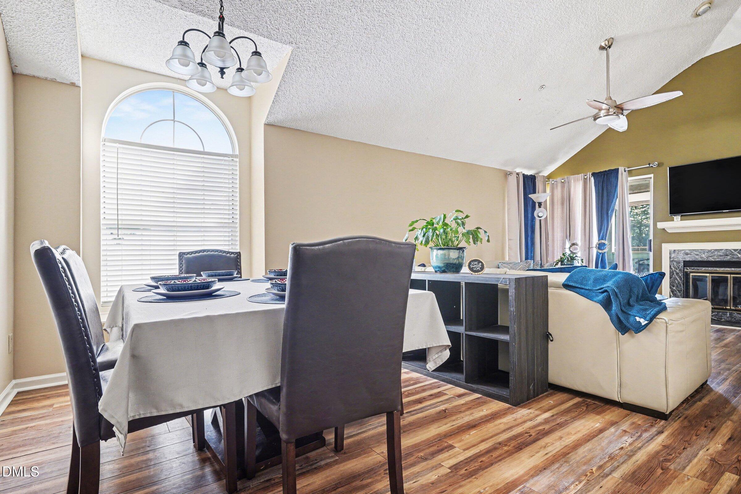 3806 Grey Harbor Drive, Unit 204 Raleigh, NC 27616 - Photo 10 of 18 a view of a dining room with furniture window and wooden floor