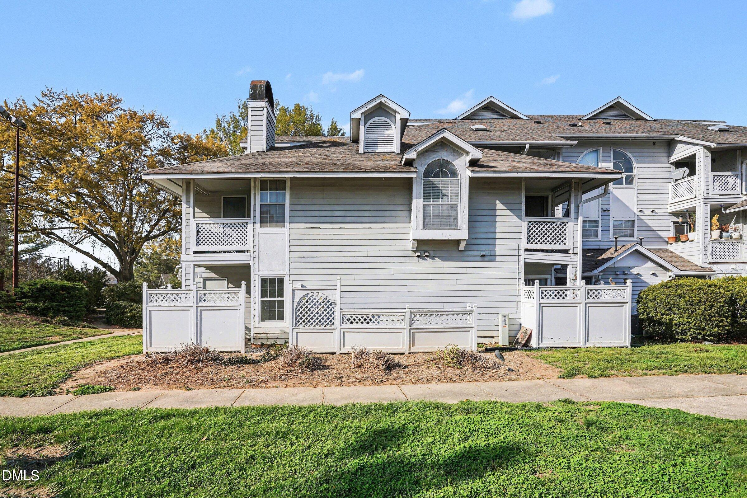 3806 Grey Harbor Drive, Unit 204 Raleigh, NC 27616 - Photo 16 of 18 a front view of a house with garden