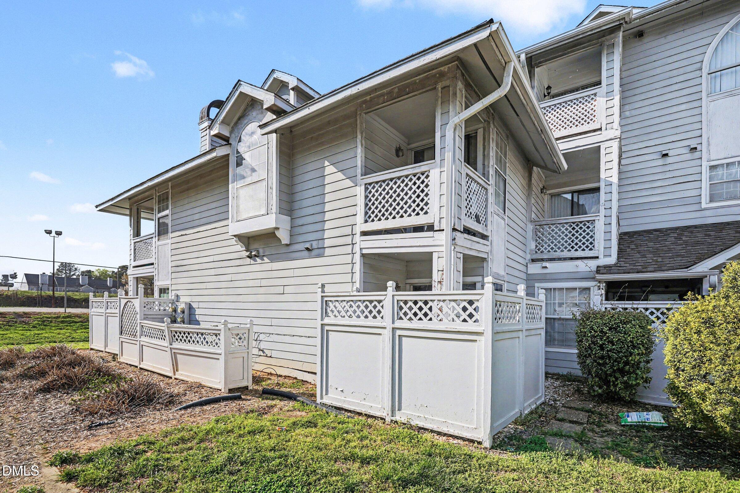 3806 Grey Harbor Drive, Unit 204 Raleigh, NC 27616 - Photo 17 of 18 a view of a house with a yard