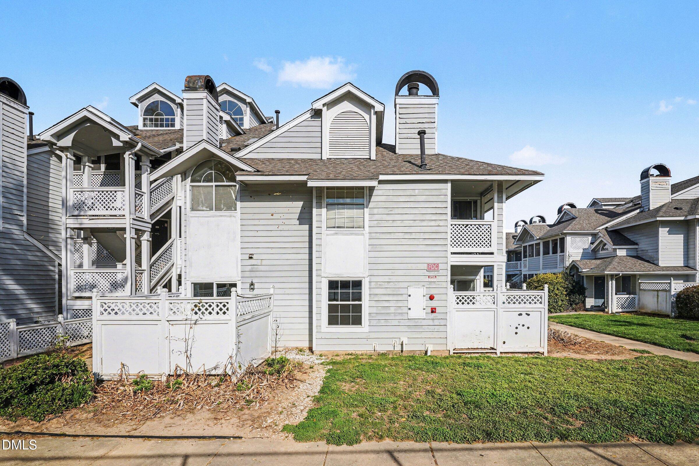 3806 Grey Harbor Drive, Unit 204 Raleigh, NC 27616 - Photo 2 of 18 a front view of a house with a yard