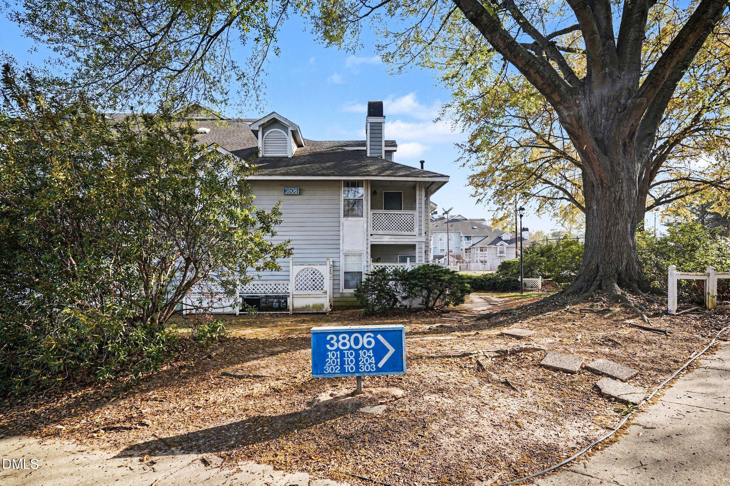3806 Grey Harbor Drive, Unit 204 Raleigh, NC 27616 - Photo 3 of 18 a front view of a house with a yard