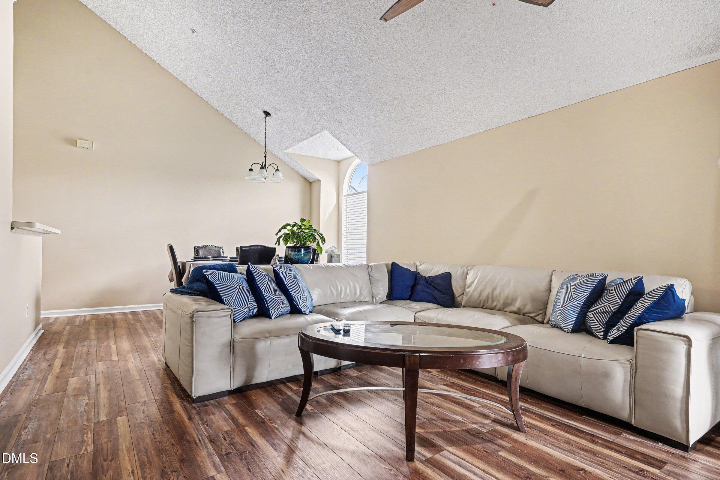 3806 Grey Harbor Drive, Unit 204 Raleigh, NC 27616 - Photo 5 of 18 a living room with furniture and wooden floor