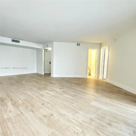 a view of a bathroom from a hallway