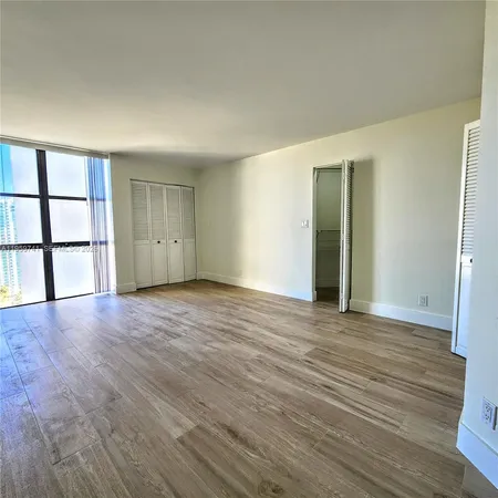 a bathroom with a mirror and a shower