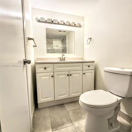 a bathroom with a toilet and shower