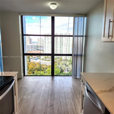 a utility room with cabinets washer and dryer