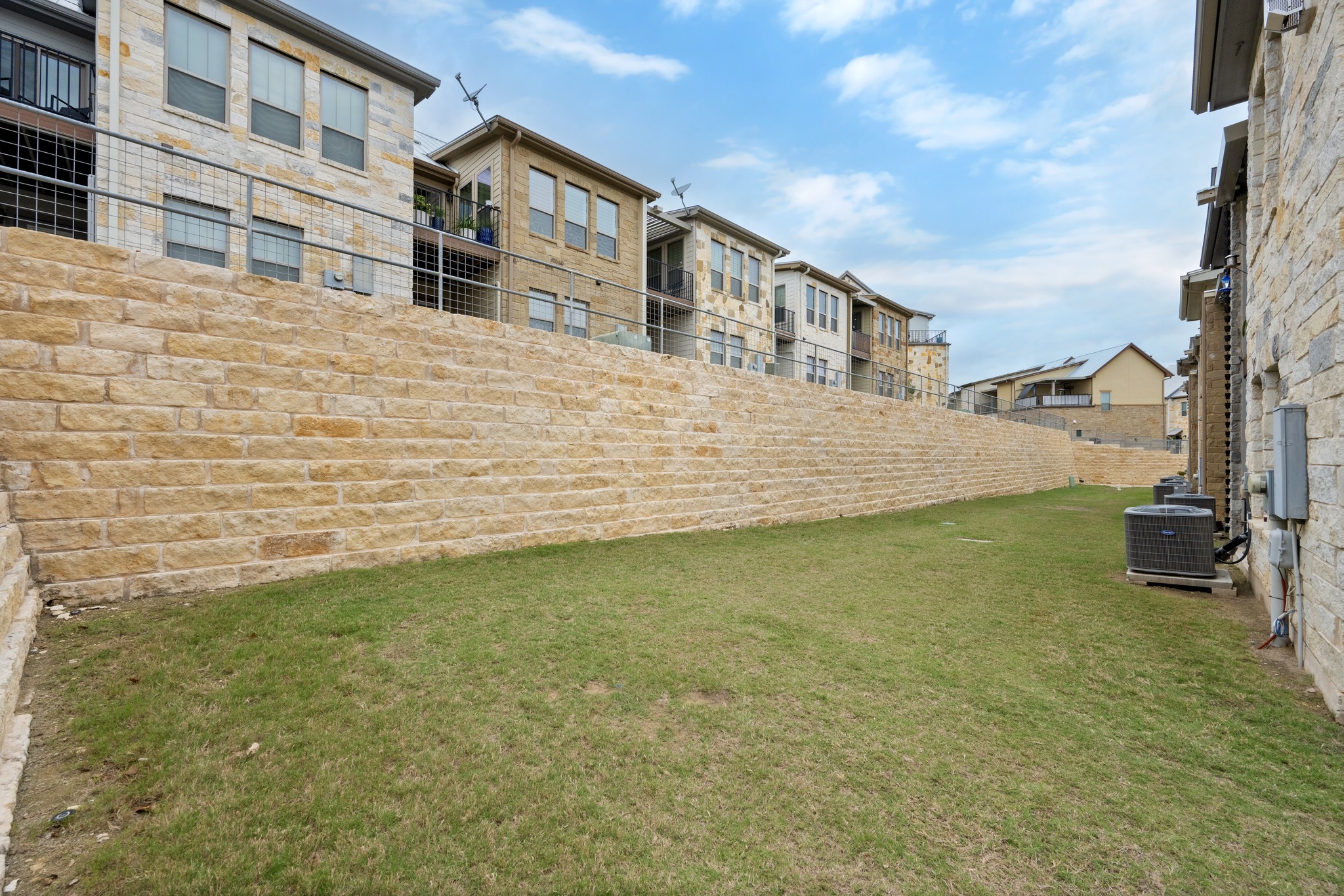 372 Adams Street Georgetown, TX 78628 - Photo 27 of 33 Stone retaining wall and a grassy area