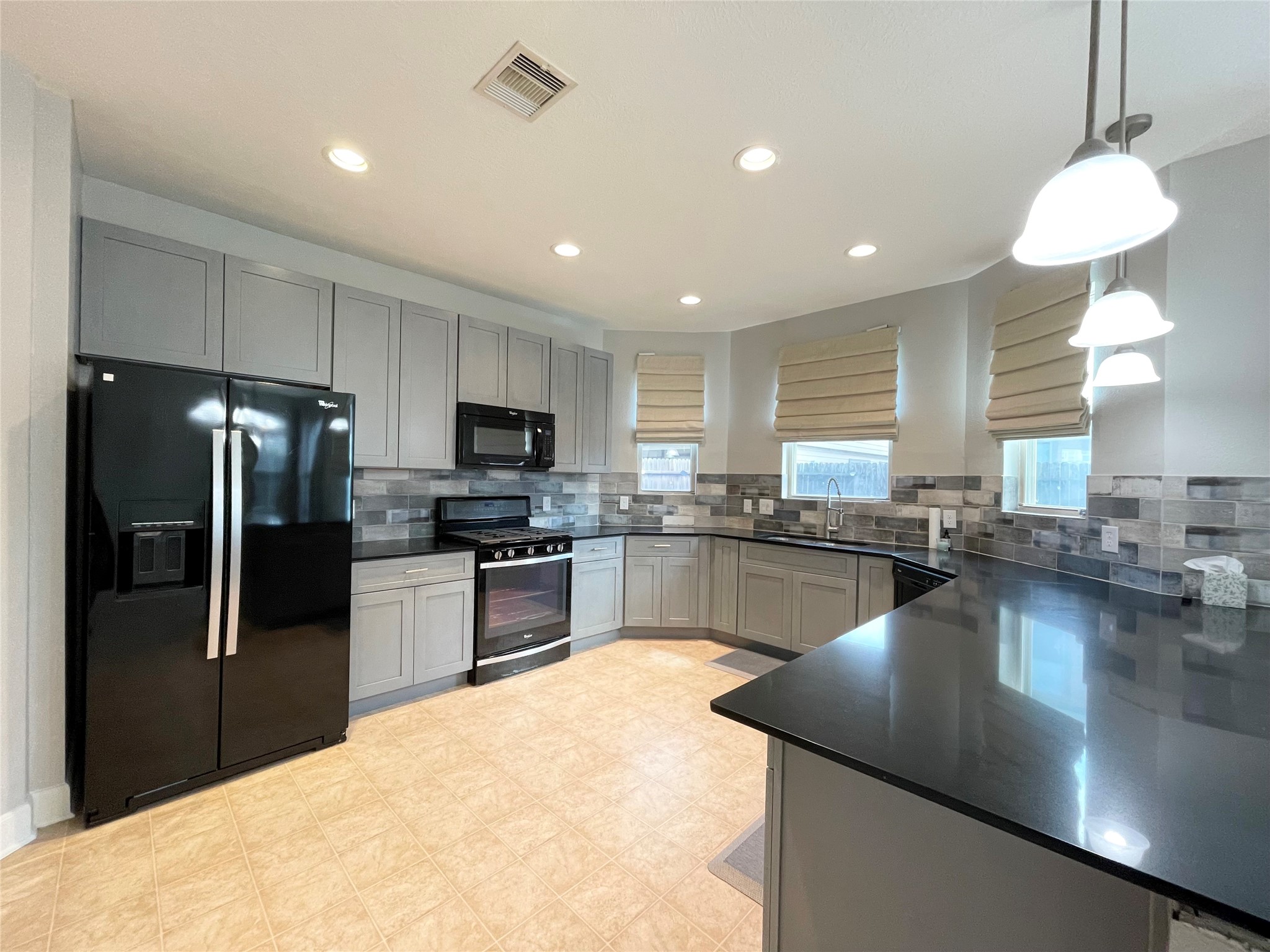 2707 Volute Houston, TX 77038 - Photo 6 of 28 Kitchen was recently renovated with brand new cabinetry and backsplash!