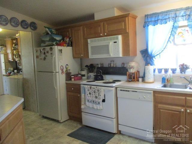 58068 Maple Circle Road Christmas Valley, OR 97641 - Photo 5 of 23 Kitchen lay out to the Utility room