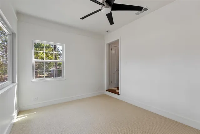 a bedroom with a bed and a table in it