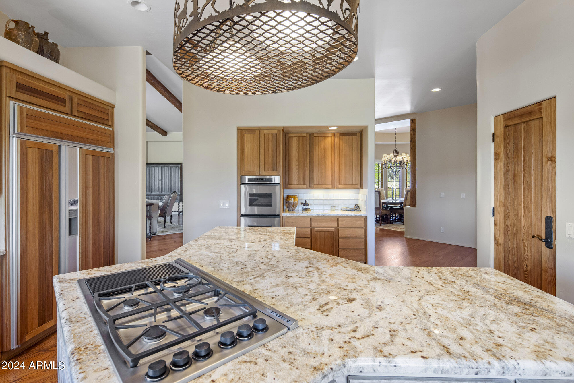 5500 Four Cross Ranch Road Skull Valley, AZ 86338 - Photo 13 of 59 a kitchen with stainless steel appliances granite countertop a stove top oven a sink and a refrigerator