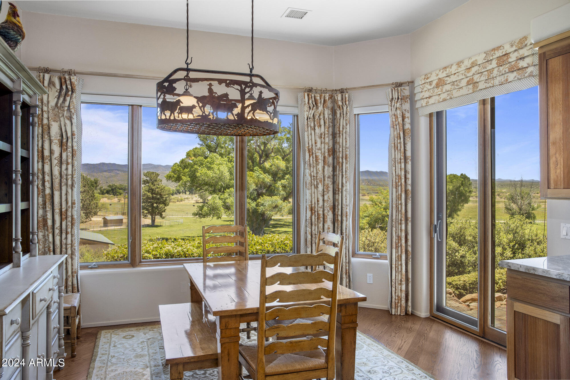 5500 Four Cross Ranch Road Skull Valley, AZ 86338 - Photo 14 of 59 a view of a dining room with furniture window and wooden floor